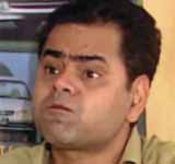 Shukla (Sanjay Mishra)